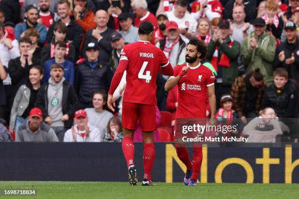 Mohamed Salah of Liverpool celebrates after scoring the team's first goal from the penalty spot during the Premier League match between Liverpool FC...