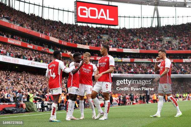 Bukayo Saka of Arsenal celebrates after an own goal by Cristian Romero of Tottenham Hotspur , Arsenal’s first goal during the Premier League match...