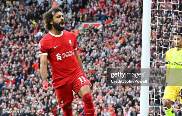 Mohamed Salah of Liverpool celebrates after scoring the opening goal during the Premier League match between Liverpool FC and West Ham United at...