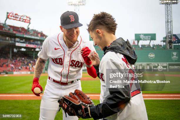 Alex Verdugo of the Boston Red Sox reacts with Moysten Hummel during a pre game ceremony ahead of a game against the Chicago White Sox on September...