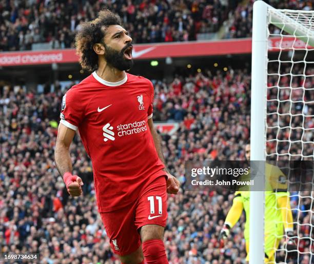 Mohamed Salah of Liverpool celebrates after scoring the opening goal during the Premier League match between Liverpool FC and West Ham United at...