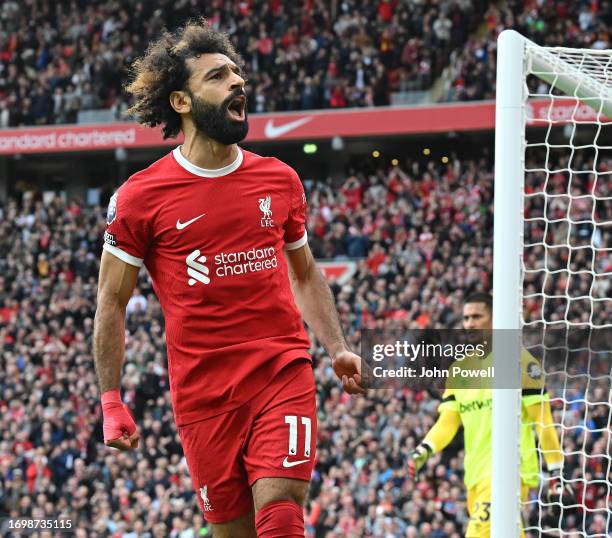 Mohamed Salah of Liverpool celebrates after scoring the opening goal during the Premier League match between Liverpool FC and West Ham United at...