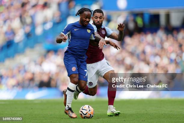 Raheem Sterling of Chelsea runs with the ball from Douglas Luiz of Aston Villa during the Premier League match between Chelsea FC and Aston Villa at...
