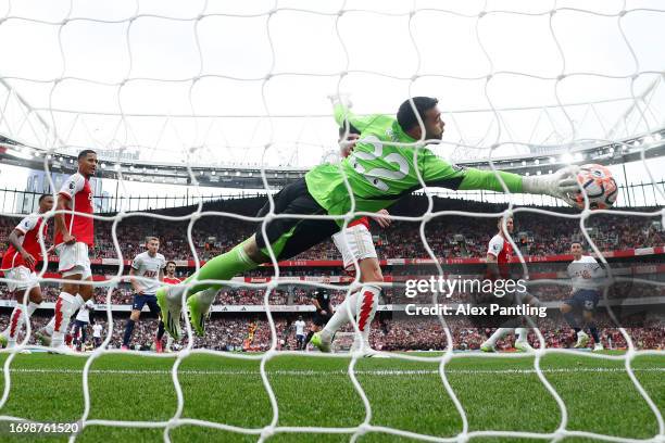 David Raya of Arsenal makes a save during the Premier League match between Arsenal FC and Tottenham Hotspur at Emirates Stadium on September 24, 2023...