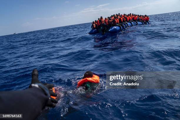 Migrants of different 14 nationalities are rescued by the Spanish NGO Open Arms in international waters, at sea on September 30, 2023. 178 migrants...