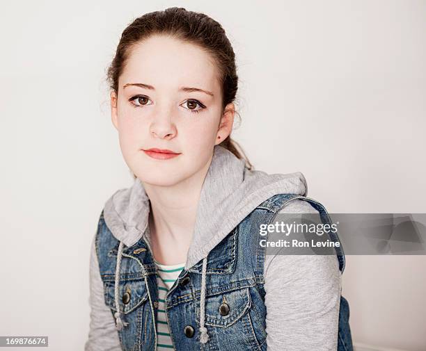 teen girl in jean jacket, portrait - 12 12 12 2013 film stock-fotos und bilder