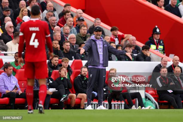 Juergen Klopp speaks to Virgil van Dijk of Liverpool during the Premier League match between Liverpool FC and West Ham United at Anfield on September...