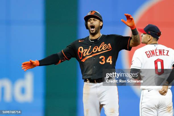 Aaron Hicks of the Baltimore Orioles celebrates a double off Emmanuel Clase of the Cleveland Guardians during the ninth inning at Progressive Field...