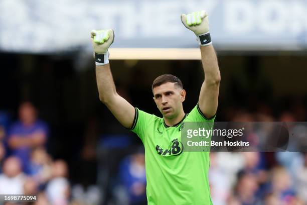 Emiliano Martinez celebrates after Ollie Watkins of Aston Villa scored their sides first goal during the Premier League match between Chelsea FC and...