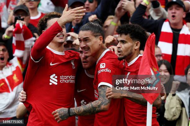 Darwin Nunez of Liverpool celebrates with teammates after scoring the team's second goal during the Premier League match between Liverpool FC and...