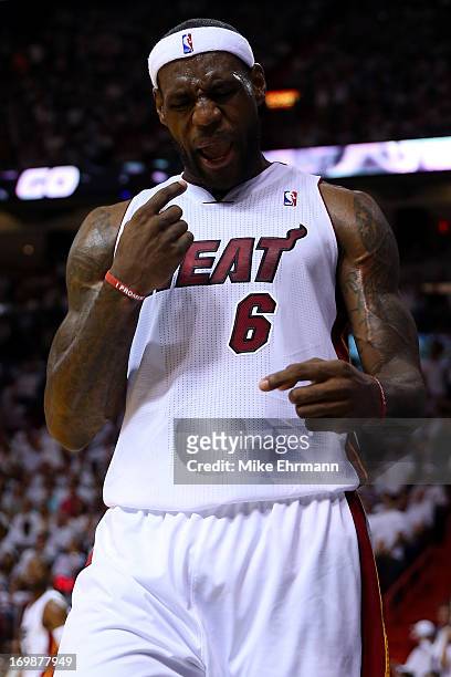 LeBron James of the Miami Heat reacts in the first half against the Indiana Pacers during Game Seven of the Eastern Conference Finals of the 2013 NBA...