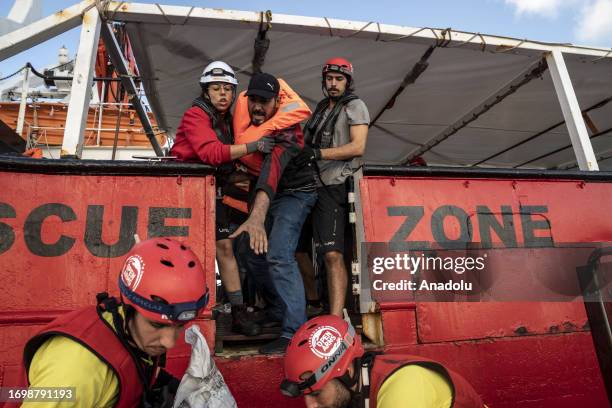 Migrants of different 14 nationalities are rescued by the Spanish NGO Open Arms in international waters, at sea on September 30, 2023. 178 migrants...