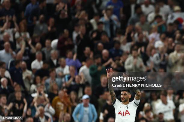 Tottenham Hotspur's Argentinian defender Cristian Romero celebrates at the end of the English Premier League football match between Tottenham Hotspur...