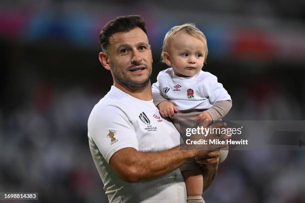 Danny Care of England appreciates the fan's applause with son Rocco at the end of the Rugby World Cup France 2023 match between England and Chile at...