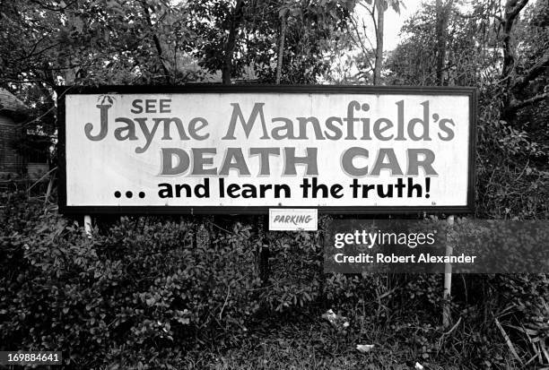 Sign at the Tragedy in U.S. History Museum in St. Augustine, Florida, advertises 'Jayne Mansfield's Death Car.' Before it closed in 1998, the small...