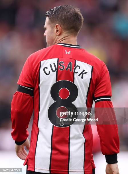 Oliver Norwood of Sheffield United looks on wearing a shirt in memory of Maddy Cusack during the Premier League match between Sheffield United and...