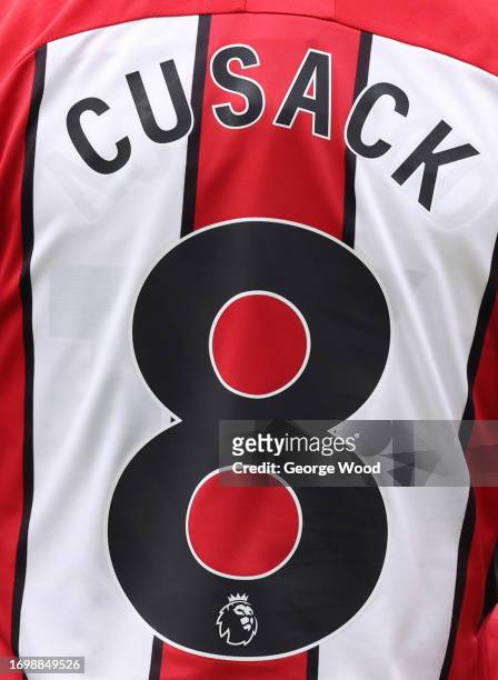 The back of the shirt in memory of Maddy Cusack is seen being worn by Oliver Norwood of Sheffield United during the Premier League match between...