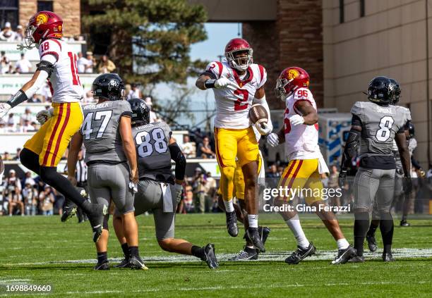 Trojans defensive end Romello Height reacts after he recovers a blocked punt against Colorado in the first half at Folsom Field at the University of...