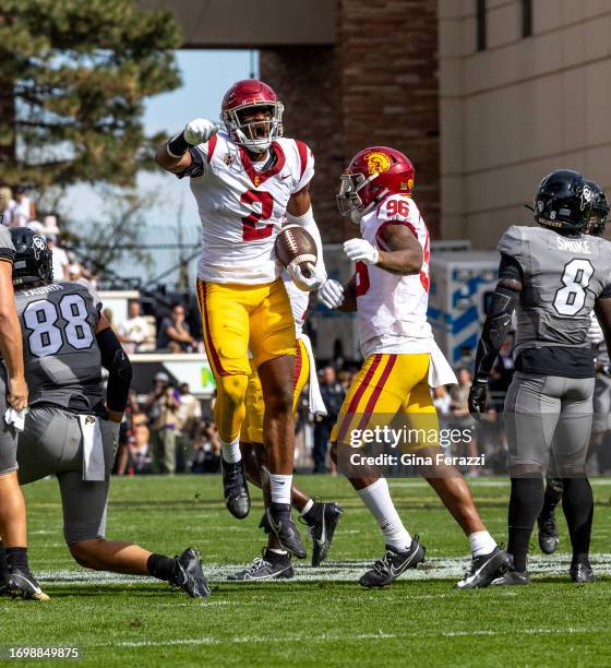 Trojans defensive end Romello Height reacts after he recovers a blocked punt against Colorado in the first half at Folsom Field at the University of...