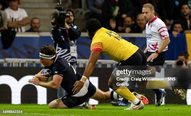 Scotland's Hamish Watson scores a try during a Rugby World Cup match between Scotland and Romania at the Stade Pierre Mauroy, on September 30 in...