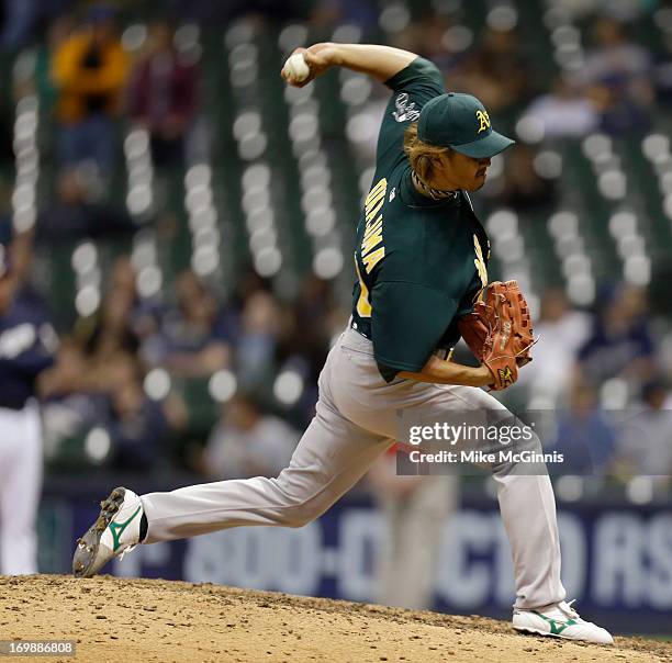 Hideki Okajima of the Oakland Athletics pitches in the bottom of the eighth inning against the Milwaukee Brewers during the interleague game at...