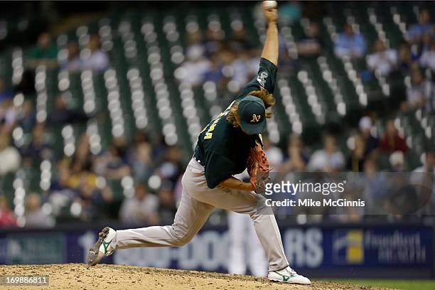 Hideki Okajima of the Oakland Athletics pitches in the bottom of the eighth inning against the Milwaukee Brewers during the interleague game at...