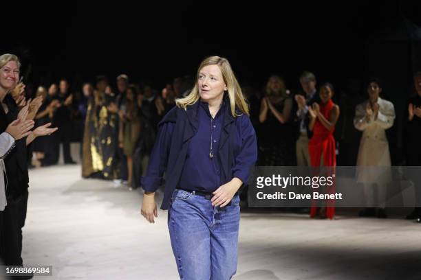 Designer Sarah Burton bows during her final show as Creative Director at the Alexander McQueen SS24 show during Paris Fashion Week at Le Carreau du...