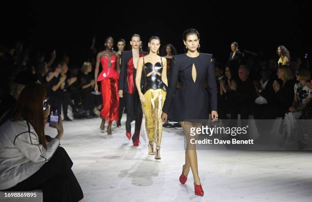 Kaia Gerber walks the runway at the Alexander McQueen SS24 show during Paris Fashion Week at Le Carreau du Temple on September 30, 2023 in Paris,...