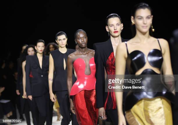 Models walk the runway at the Alexander McQueen SS24 show during Paris Fashion Week at Le Carreau du Temple on September 30, 2023 in Paris, France.