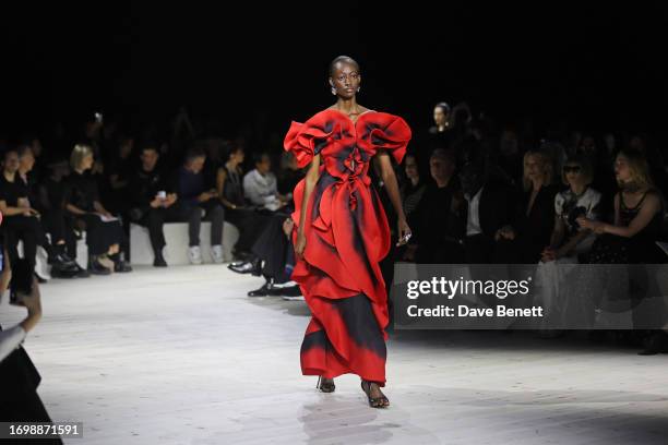 Model walks the runway at the Alexander McQueen SS24 show during Paris Fashion Week at Le Carreau du Temple on September 30, 2023 in Paris, France.