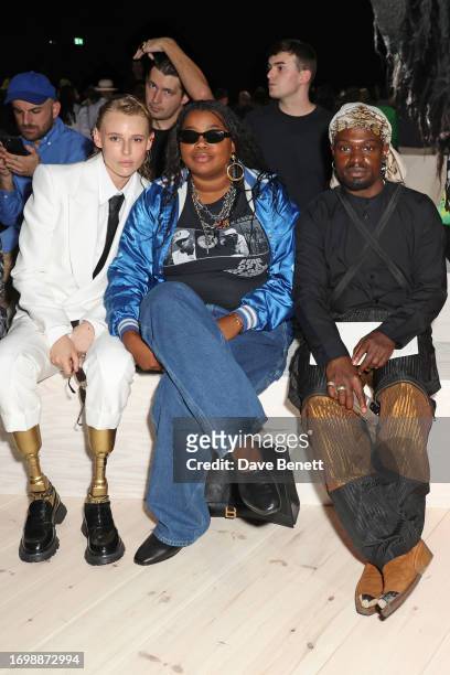 Lauren Wasser, Gabriella Karefa-Johnson and Campbell Addy attend the Alexander McQueen SS24 show during Paris Fashion Week at Le Carreau du Temple on...