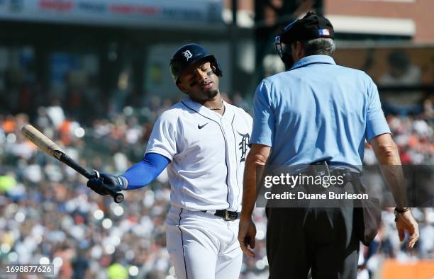 Andy Ibanez of the Detroit Tigers reacts after being called out on strikes by home plate umpire Angel Hernandez during the fourth inning of a game...