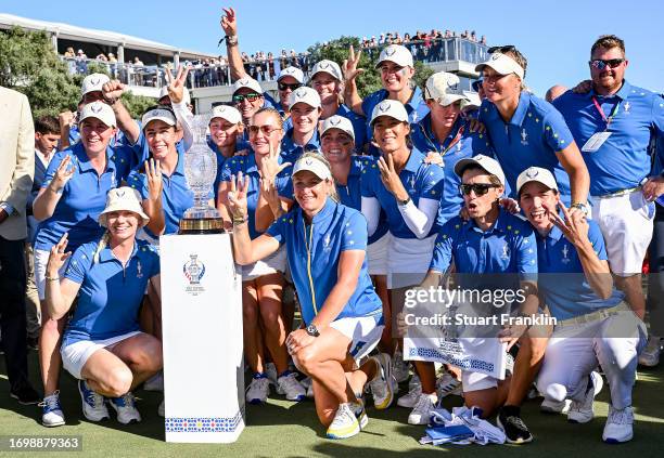 Team Europe poses for a group photo with the Solheim Cup after defeating Team USA during Day Three of The Solheim Cup at Finca Cortesin Golf Club on...