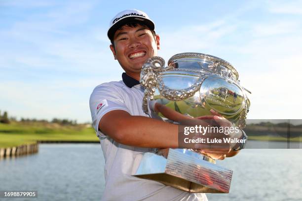 Ryo Hisatsune of Japan celebrates with the trophy after winning on Day Four of the Cazoo Open de France at Le Golf National on September 24, 2023 in...