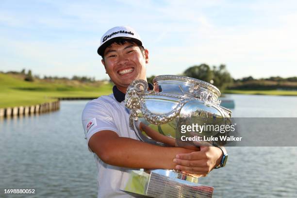 Ryo Hisatsune of Japan celebrates with the trophy after winning on Day Four of the Cazoo Open de France at Le Golf National on September 24, 2023 in...