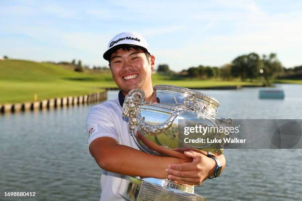 Ryo Hisatsune of Japan celebrates with the trophy after winning on Day Four of the Cazoo Open de France at Le Golf National on September 24, 2023 in...