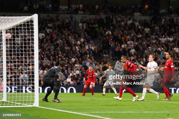 Joel Matip of Liverpool scores an own goal in injury time during the Premier League match between Tottenham Hotspur and Liverpool FC at Tottenham...