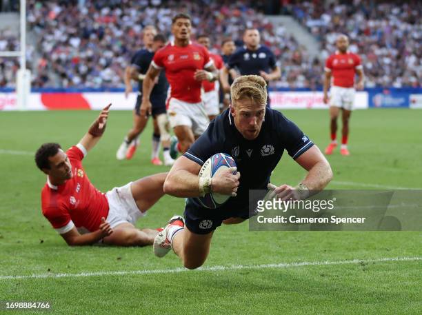 Kyle Steyn of Scotland scores his team's third try during the Rugby World Cup France 2023 match between Scotland and Tonga at Stade de Nice on...