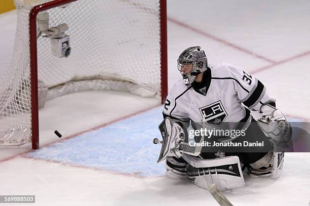 Goaltender Jonathan Quick of the Los Angeles Kings fails to make the save as the puck goes into the net for a goal on a shot from Michal Handzus of...