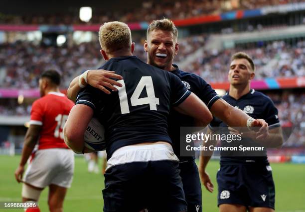 Kyle Steyn of Scotland celebrates with George Turner of Scotland after scoring his team's third try during the Rugby World Cup France 2023 match...