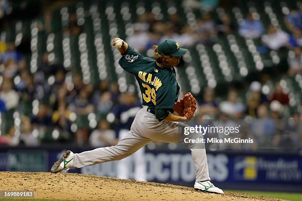 Hideki Okajima of the Oakland Athletics pitches in the bottom of the eighth inning against the Milwaukee Brewers during the interleague game at...