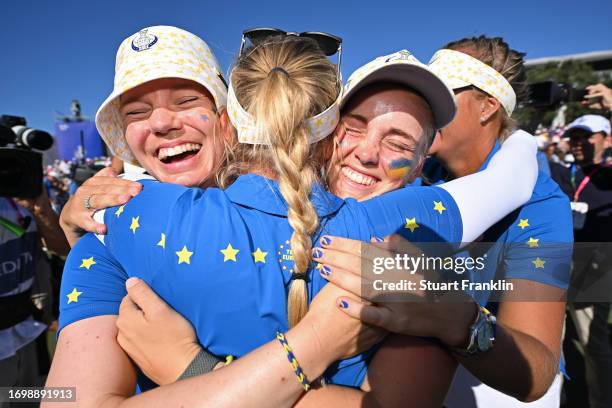 Madelene Sagstrom, captain Suzann Pettersen and Maja Stark of Team Europe celebrate their win against Team USA during Day Three of The Solheim Cup at...