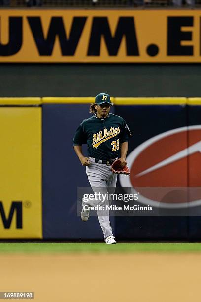 Hideki Okajima of the Oakland Athletics takes to the field in the bottom of the eighth inning against the Milwaukee Brewers during the interleague...