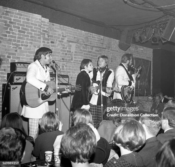 Mike Settle, Thelma Camacho, Terry Williams and bass player and singer Kenny Rogers of the rock and roll band "The First Edition" perform at the...