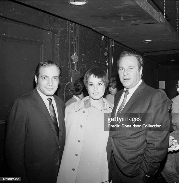 Singer Thelma Camacho of the rock and roll band "The First Edition"poses for portraits with members of the audience at the Bitter End night club on...