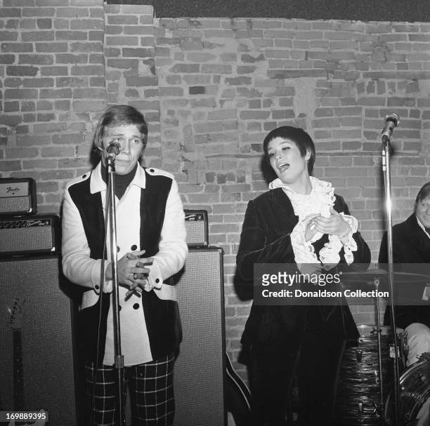 Terry WIlliams, singer Thelma Camacho and drummer Mickey Jones of the rock and roll band "The First Edition"poses for portraits with members of the...