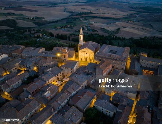 night evening aerial view of medieval pienza town in tuscany, siena province, italy, scenic landscape of historic village in southern tuscany - san quirico d'orcia bildbanksfoton och bilder