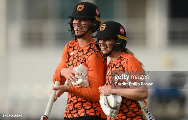 Emily Windsor and Freya Kemp leave the field after Southern Vipers won the Rachael Heyhoe Flint Trophy Final between Southern Vipers and The Blaze at...