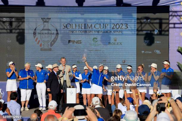 Suzann Pettersen of Norway the Captain of The European Team is presented with the Solheim Cup after being presented with the cup by John Solheim The...