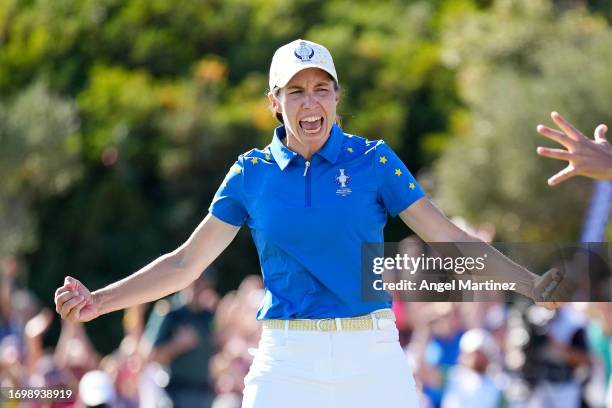 Carlota Ciganda of Team Europe celebrates after sinking a birdie on the 17th green and securing the Solheim Cup win for Team Europe against Team USA...